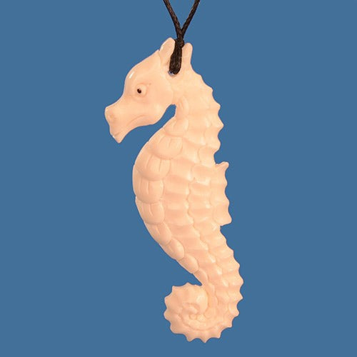 Handmade bone carved seahorse pendant necklace, showcasing intricate artistry and cultural significance, on an adjustable cord.