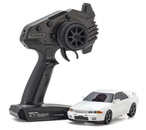 White Radio Control Kyosho MA020 Nissan GT-R (R32) model, showcasing detailed design and high-performance features.