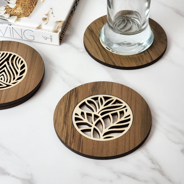 Handcrafted 10cm River Rimu coaster with unique colors and Pine veneer inlay, showcasing New Zealand's natural beauty.