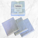 Set of 3 grey dish cloths by BAKSANA, made from 100% cotton, stylish and absorbent for kitchen cleaning.