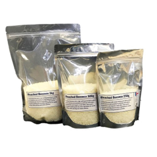 Refined white pellets of As Bleached Beeswax 1 Kilo for encaustic painting, candle making, and vibrant crafts.