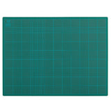 Vibrant green 600x450mm cutting mat, 3mm PVC, self-healing, gridded for precise cuts, perfect for crafting and quilting.