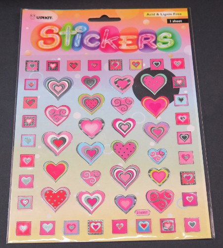 Vibrant pink heart sticker for personalizing devices and crafts, durable and weather-resistant for lasting style.