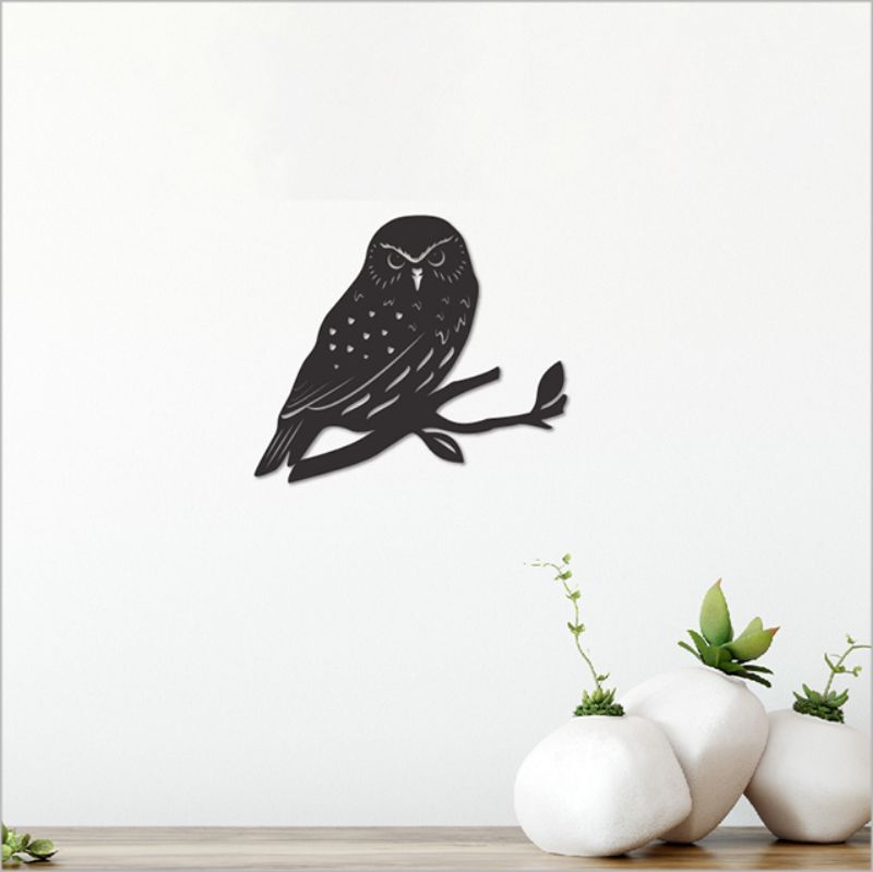 Elegant black acrylic Morepork wall art, 10.7cm, perfect for enhancing bedroom or living room decor.