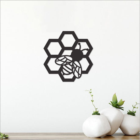 Elegant 10.8cm black acrylic bee wall art, perfect for modern home decor and versatile in any room's aesthetic.