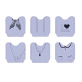 Pack of 60 stylish disposable bibs for girls, featuring soft fiber material and colorful motifs, perfect for mess-free meals.