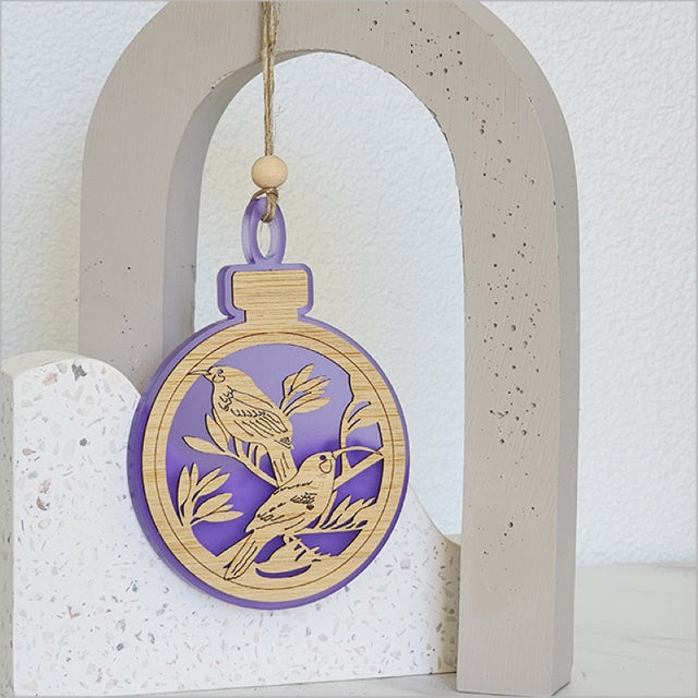 Purple Satin Acrylic Hanging Ornament featuring a Huia bird design, perfect for holiday decor or gifts.