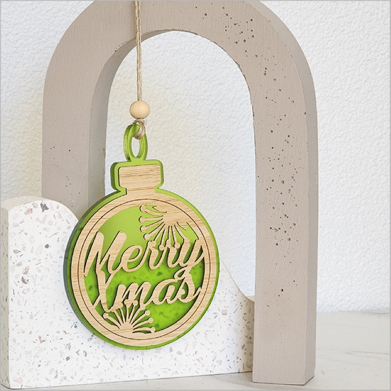 Vibrant lime satin acrylic Christmas ornament with intricate laser-cut bamboo design, ready to hang for festive decor.