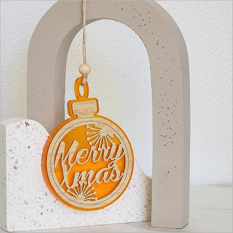 Vibrant orange satin acrylic bauble ornament with Merry Xmas design, perfect for holiday decorating or gifting.