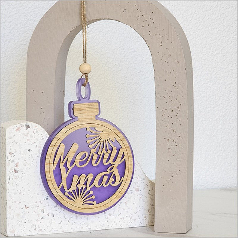 Purple satin acrylic bauble ornament featuring a laser-cut 'Merry Xmas' design, perfect for festive decor.