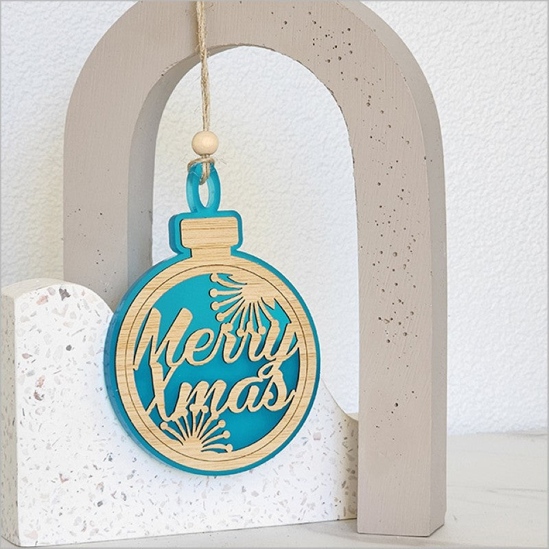 Teal satin acrylic hanging ornament featuring intricate laser-cut bamboo design, perfect for Christmas decor.