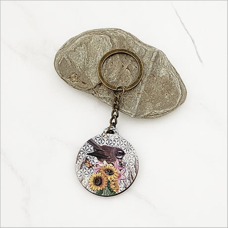 Floral Fantail printed keychain in pine veneer, featuring vibrant colors and Kiwiana design, 40mm diameter, perfect for keys.
