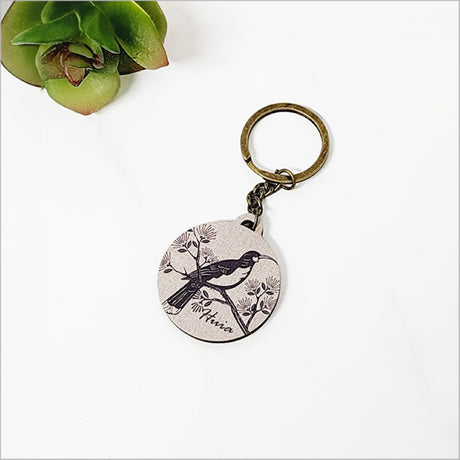 Lightweight printed keychain made from eco-friendly pine veneer, showcasing Kiwiana charm and measuring 40mm in diameter.