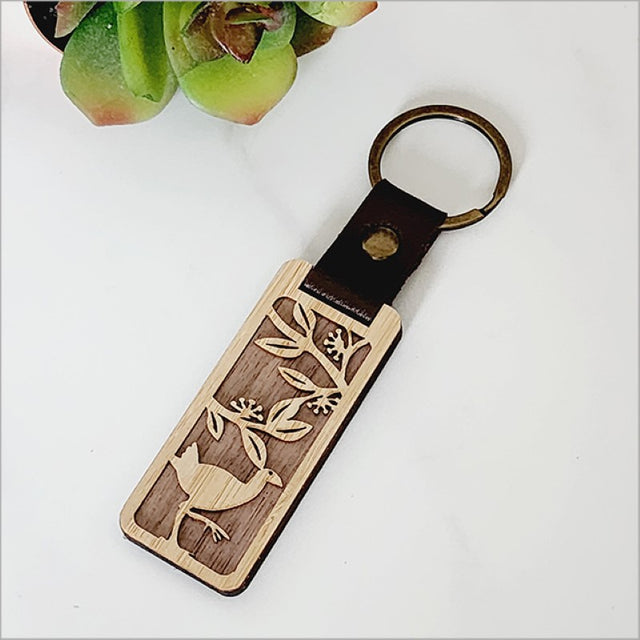 Bamboo keyring featuring a charming Pukeko design, showcasing Kiwiana culture, lightweight and eco-friendly.