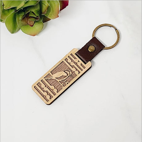 Lightweight bamboo keyring with Kingfisher design and Koru pattern, perfect for eco-friendly style and Kiwiana charm.