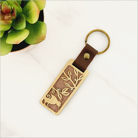Eco-friendly bamboo keyring featuring a Kiwi design, lightweight and durable for keys or bags, measuring 110mm in total length.