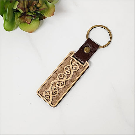 Lightweight bamboo keyring with Kiwiana design, laser cut, perfect for stylish everyday use and overseas gifts.