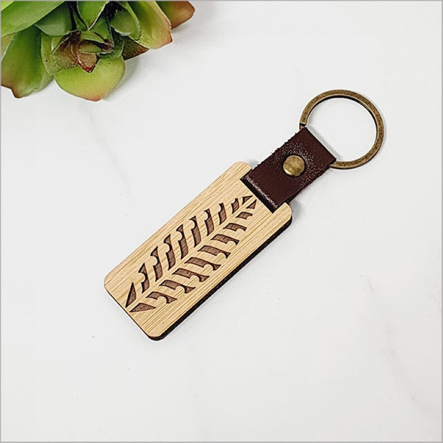 Eco-friendly bamboo keyring with Kiwiana charm, lightweight and stylish for key organization.