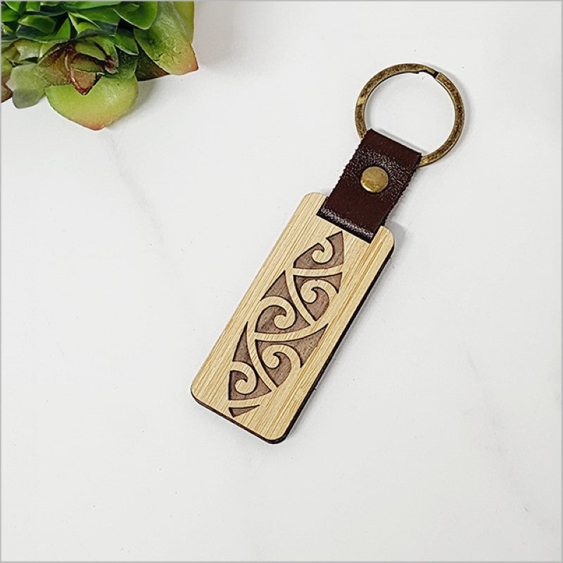 Eco-friendly bamboo keyring with Kiwiana design, lightweight, durable, and stylish for everyday key organization.