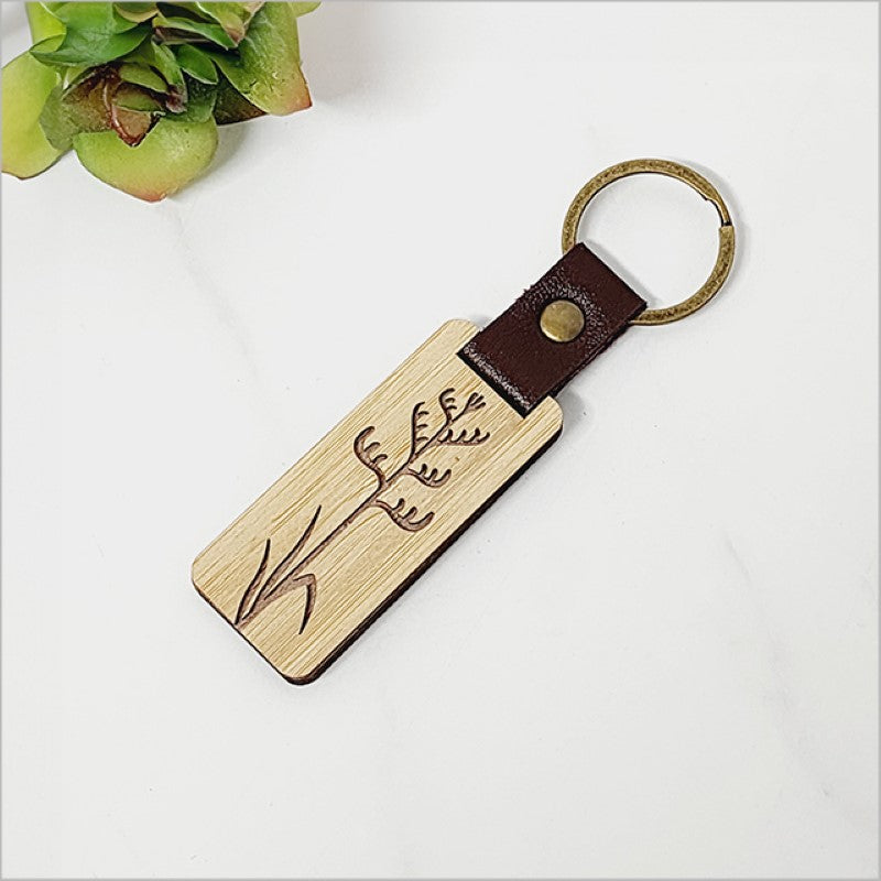Eco-friendly bamboo keyring featuring Kiwiana design; lightweight, durable, and stylish, perfect for everyday use.