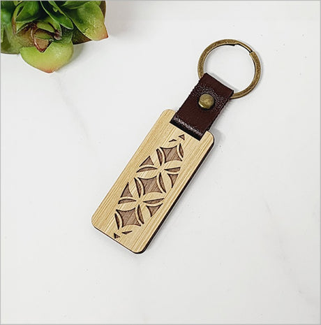 Eco-friendly bamboo veneer keyring Tapa, lightweight and stylish, infused with Kiwiana charm for everyday use.