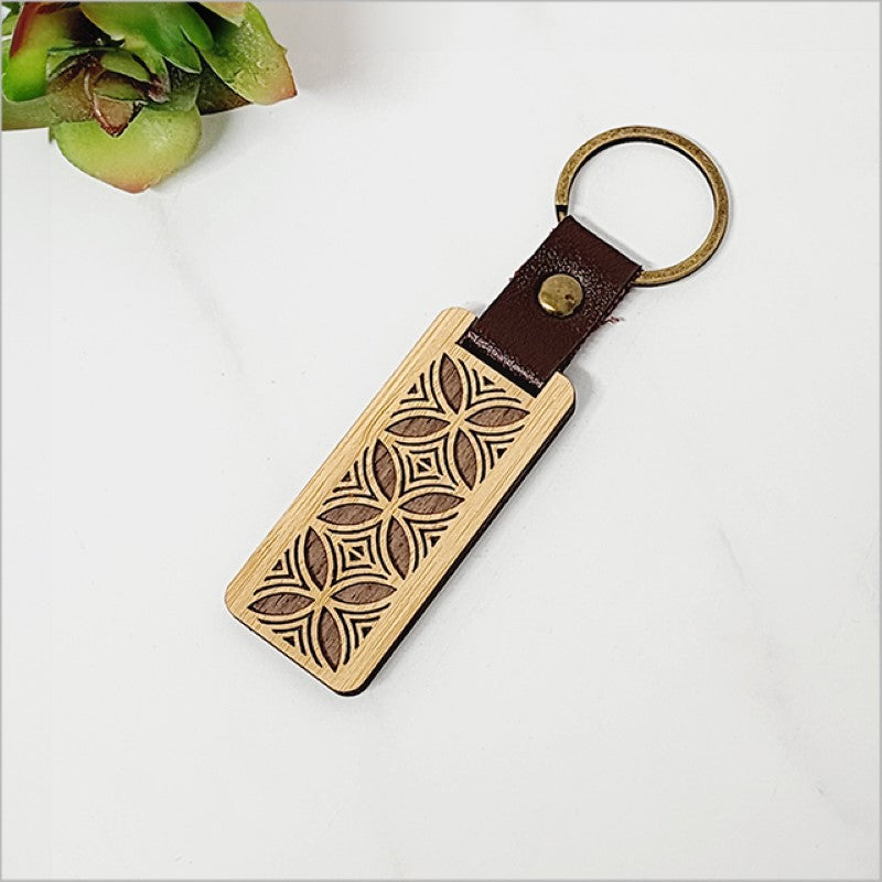Eco-friendly bamboo keyring featuring Kiwiana charm, lightweight and stylish, perfect souvenir or gift from New Zealand.