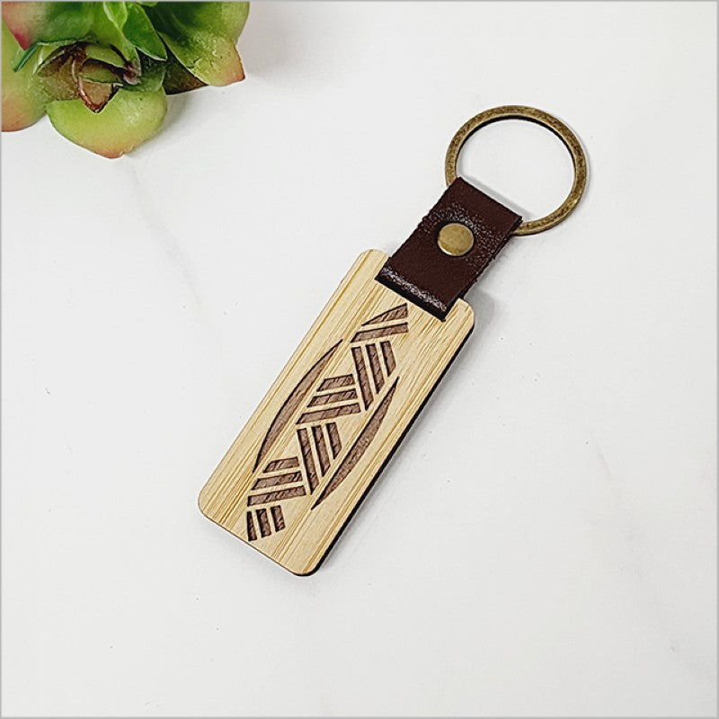 Eco-friendly bamboo keyring featuring a woven design, perfect for organizing keys with a touch of Kiwiana style.