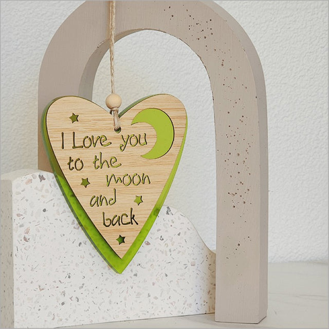 Lime satin acrylic heart ornament with moon design, perfect for festive decor or as a heartfelt gift.