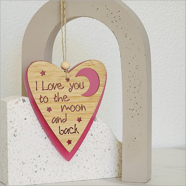 Pink satin acrylic heart and moon ornament, intricately designed, ready to hang, perfect gift for loved ones.