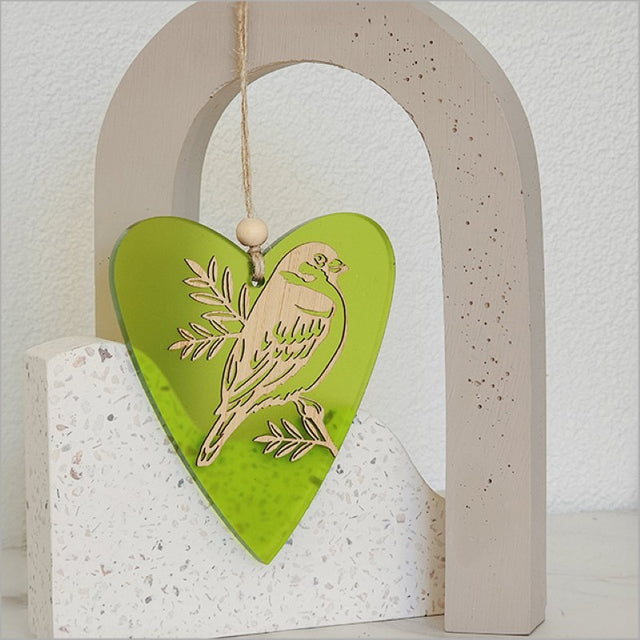 Bright lime heart-shaped ornament with bamboo and satin acrylic, perfect for festive decor and gifts.