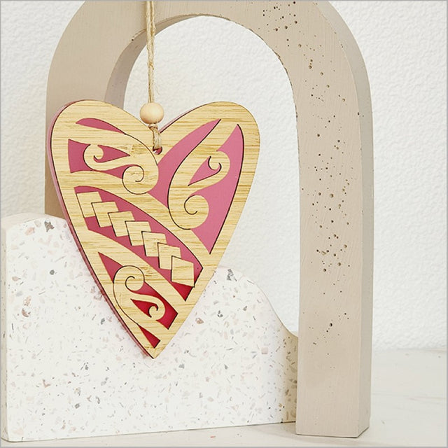 Pink satin acrylic heart ornament crafted from bamboo, perfect for home decor or as a thoughtful gift.