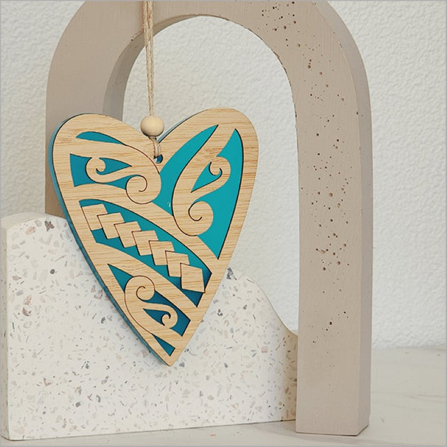 Teal satin acrylic heart ornament with intricate bamboo design, perfect for holiday decor and gifting.