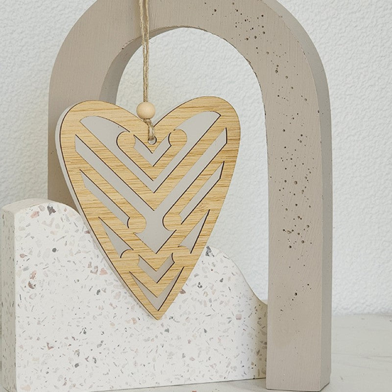 Elegant white satin acrylic heart ornament with koru patterns, perfect for decor and thoughtful gifts.