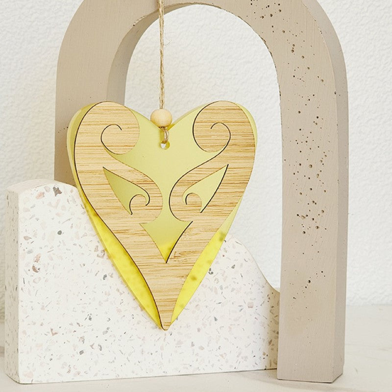 Yellow satin acrylic heart-shaped hanging ornament with laser-cut bamboo, symbolizing new beginnings and perfect for decor or gifts.