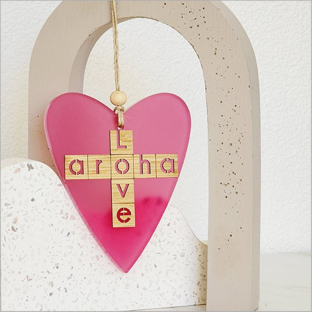 Pink satin acrylic heart ornament with laser cut bamboo, ready to hang, ideal for gifts or decorations.