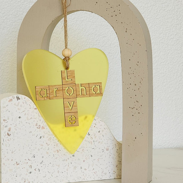 Yellow satin acrylic heart ornament with laser-cut bamboo, perfect for hanging and gifting.