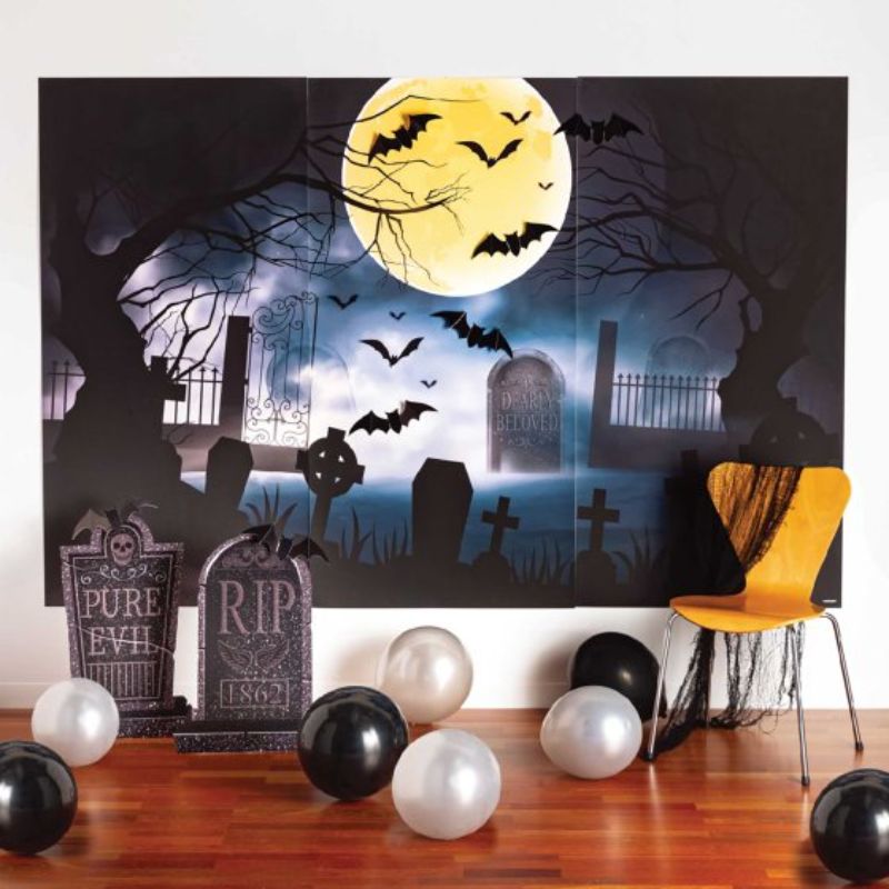 Deluxe graveyard backdrop kit with tombstones, bats, and plastic sheets for spooky decorations, pack of 12.
