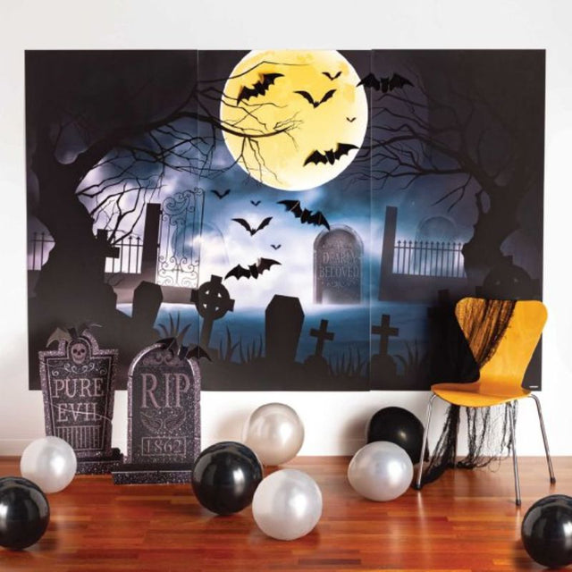 Deluxe graveyard backdrop kit with tombstones, bats, and plastic sheets for spooky decorations, pack of 12.
