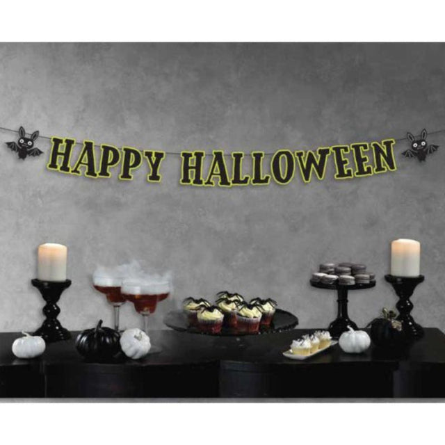 Colorful 'Happy Halloween' banner with playful bats, perfect for festive decorations and gatherings.