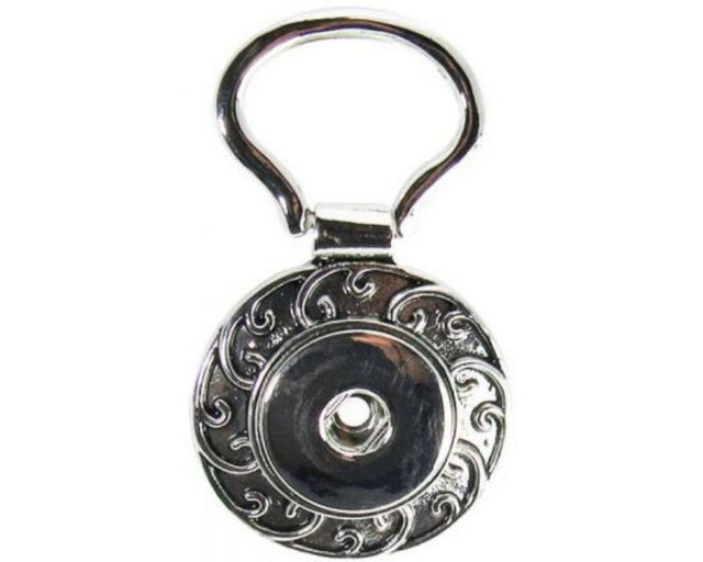 Vibrant Snaps REDFOX Key Ring Koru features a spiral koru design, 5x3 cm, perfect for stylish key organization.