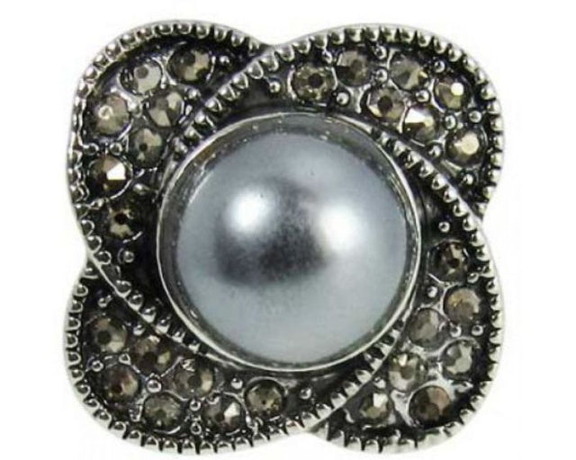 Elegant black faux pearl centerpiece with delicate flower petals for versatile accessory personalization.
