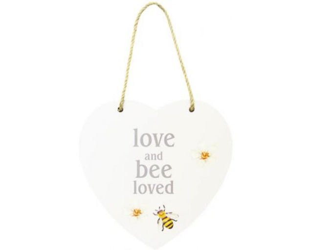 Heart-shaped MDF sign with 'Love, and Bee Loved' message, twine hanger, perfect for home decor.