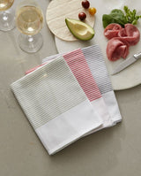 Set of three absorbent tea towels in Smoke, Chilli, and Sweet Pea colors, made from sustainable OEKO-TEX® cotton.