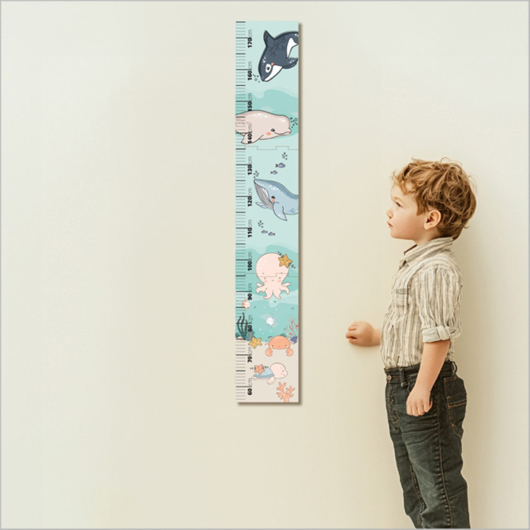 Colorful patchwork sea life growth chart ruler for children's rooms; tracks height with markers, includes puzzle pieces.