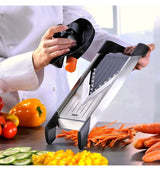 GEFU Mandoline Slicer with Japanese steel blades, 3 interchangeable blades, V-slicer, and safety features for precise vegetable cutting.