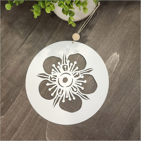 Elegant white acrylic circle wall art featuring a Manuka design, perfect for modern decor and easy to hang.