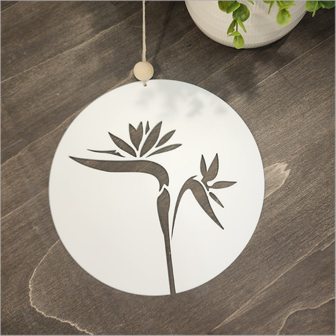 Elegant white acrylic circle featuring a Bird of Paradise design, perfect for enhancing modern home decor.