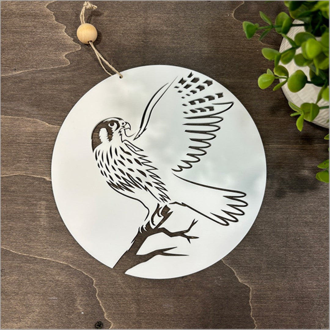 White acrylic wall art featuring a falcon design, perfect for bedroom decor, 200mm in diameter, ready to hang.