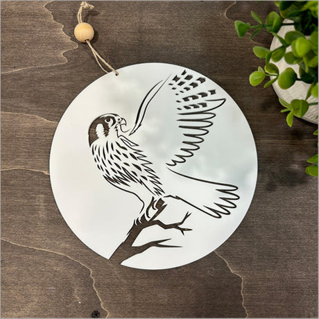 White acrylic wall art featuring a falcon design, perfect for bedroom decor, 200mm in diameter, ready to hang.