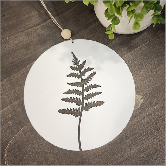 Elegant white acrylic wall art featuring a delicate fern design in a circular shape, perfect for modern home decor.